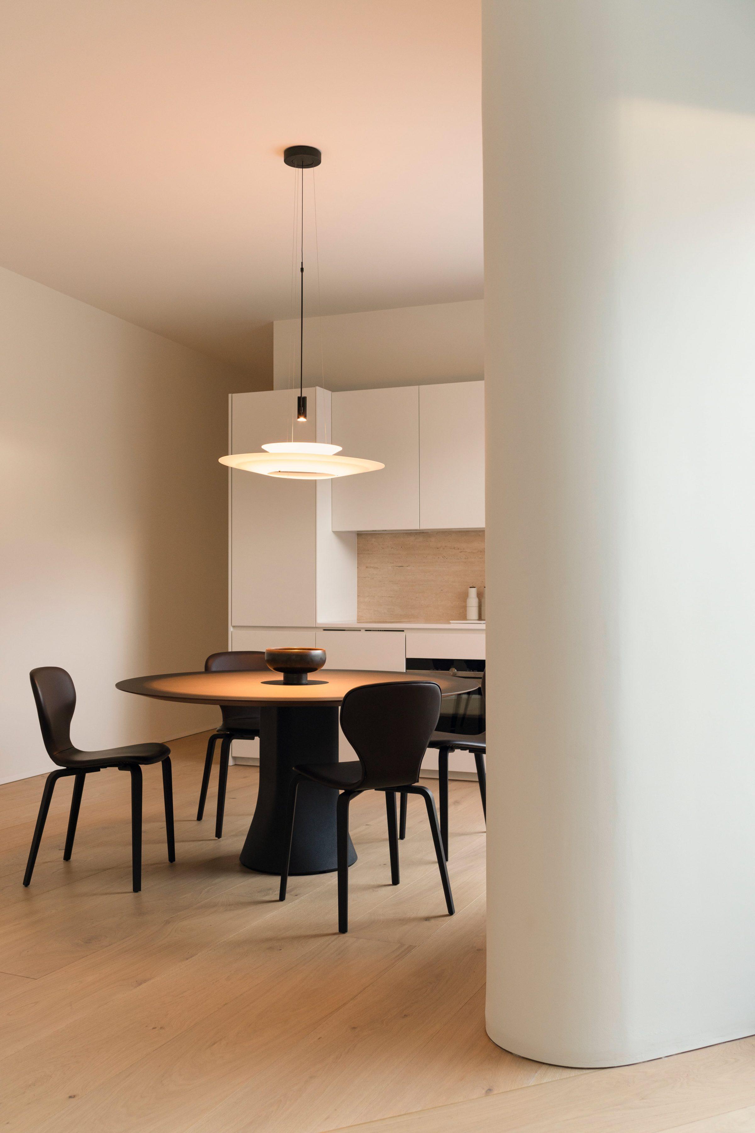 1928 Penthouse — dining table beside the structural column