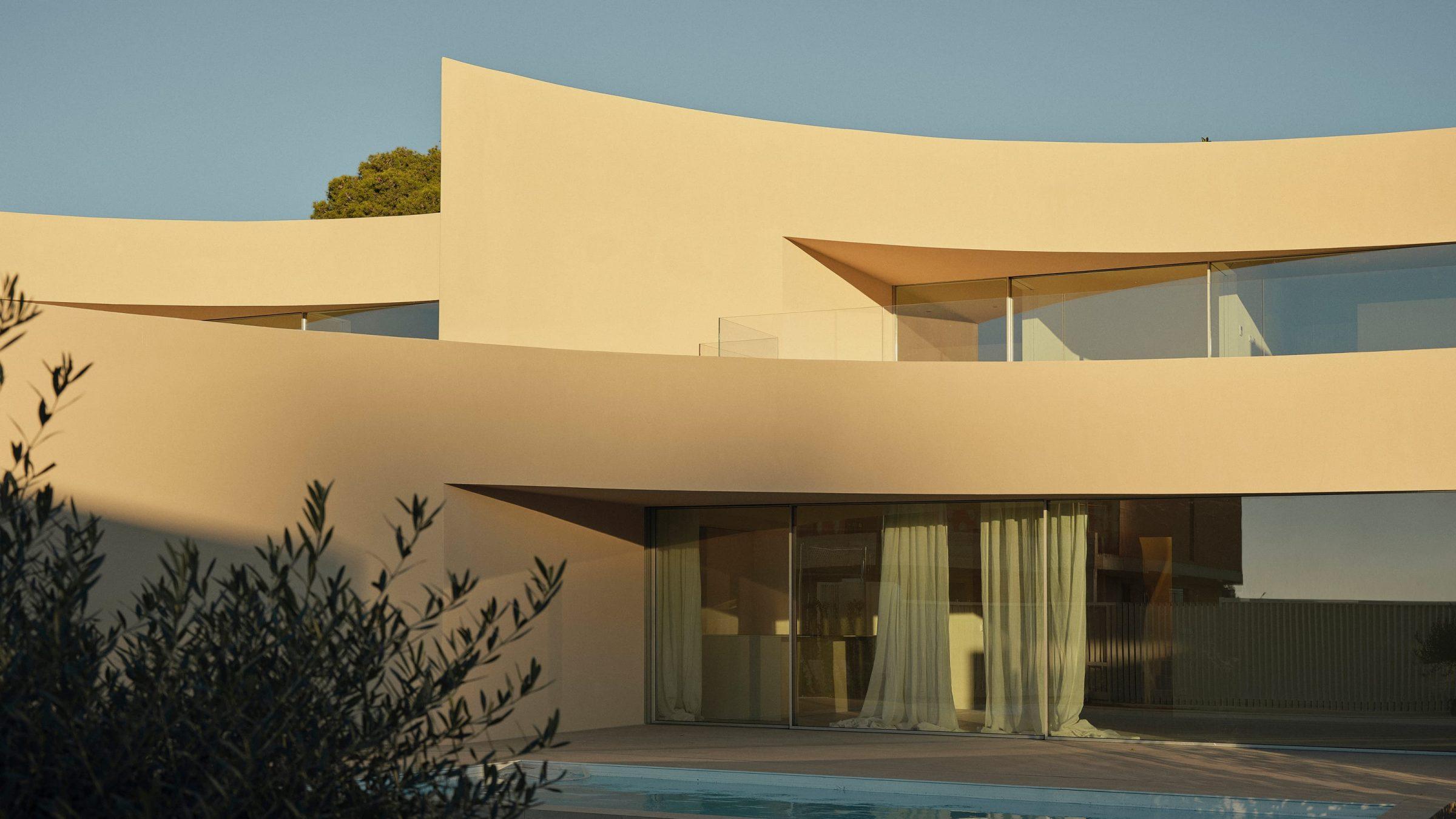 Alfinach Development — south facade with pool, curved volume and shaded openings