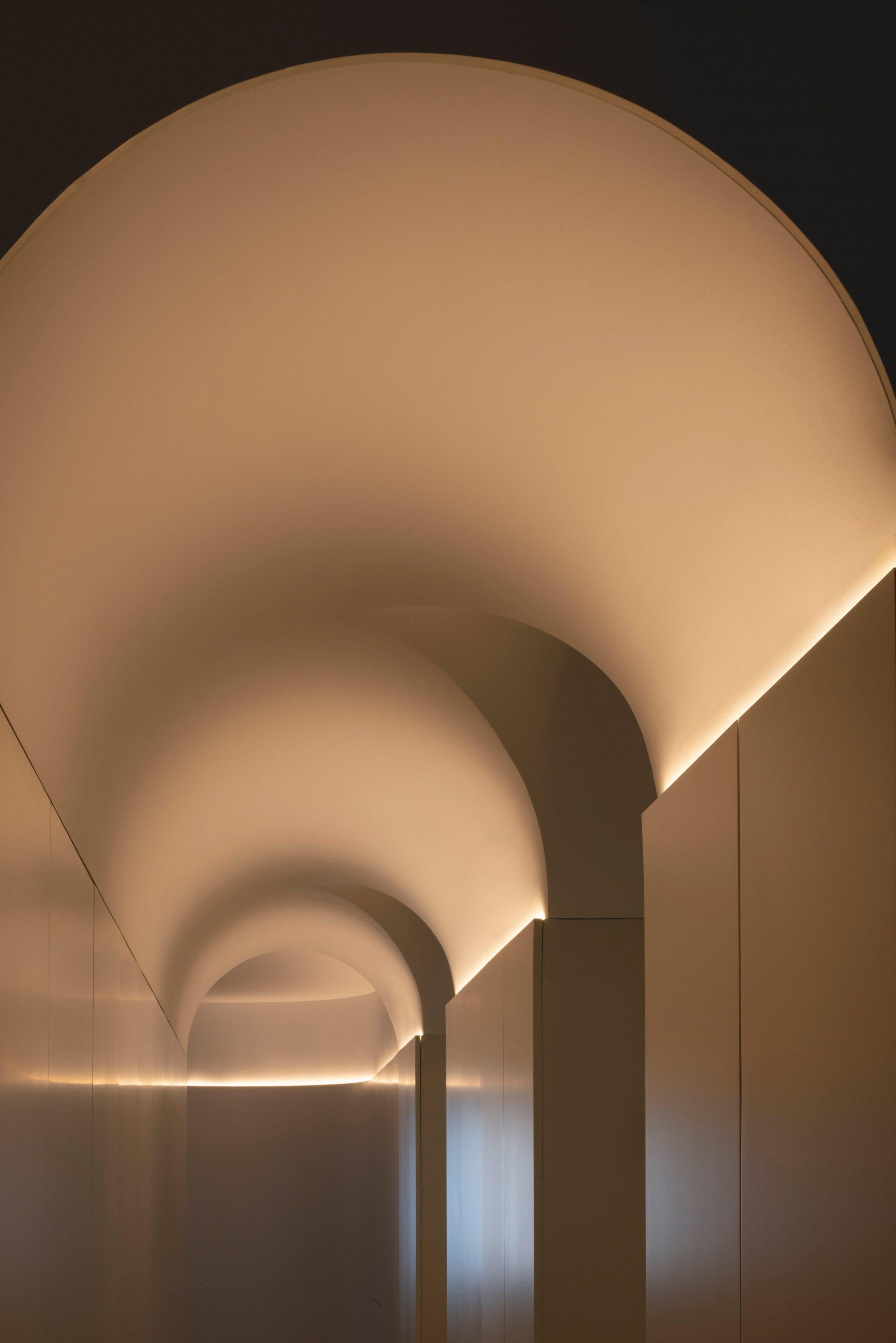 AO17 Apartment — vaulted entrance corridor with original mouldings preserved and indirect cove lighting