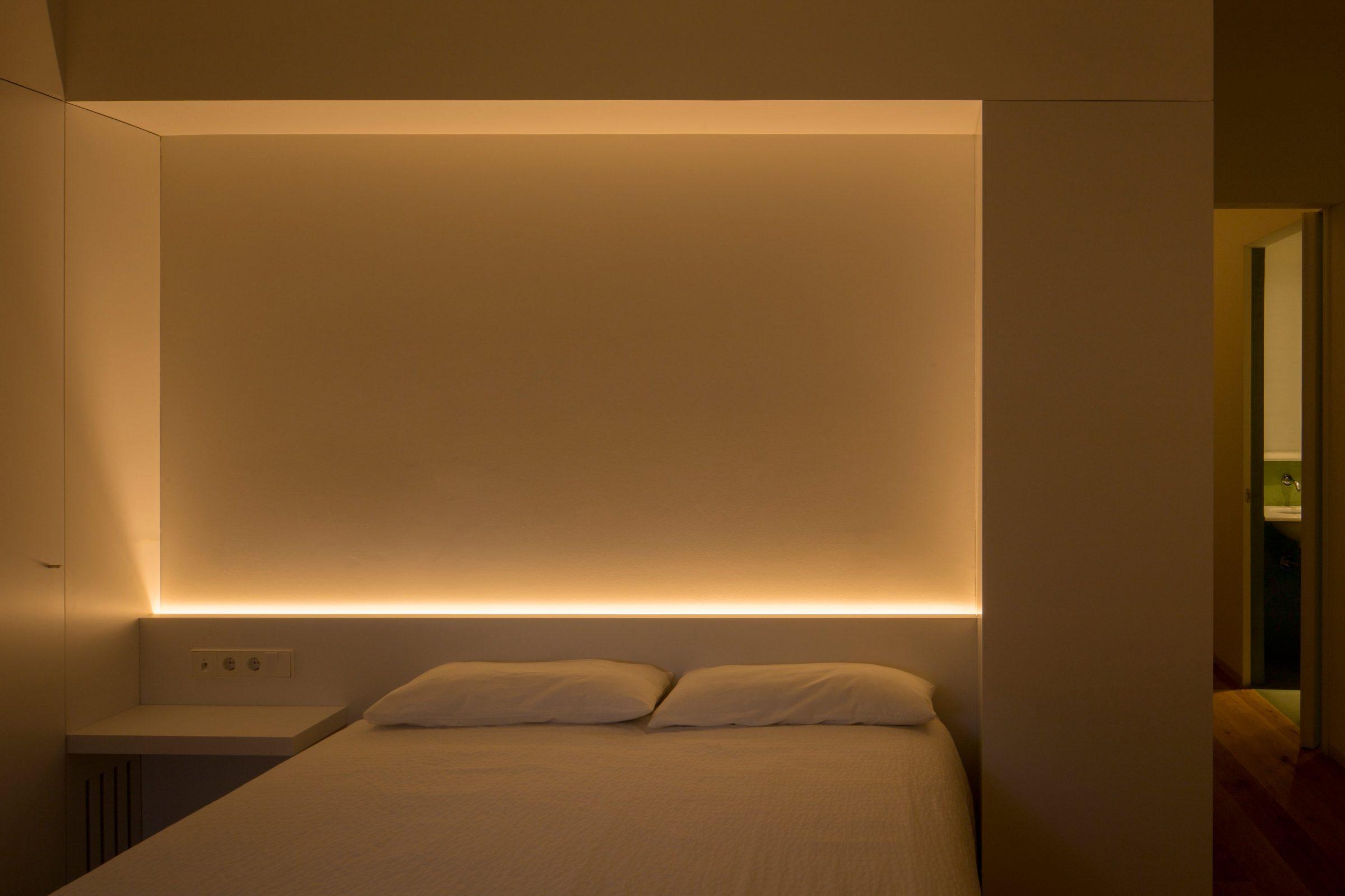 Ciscar Apartment — long view through the apartment, hallway light line accentuating the sequence