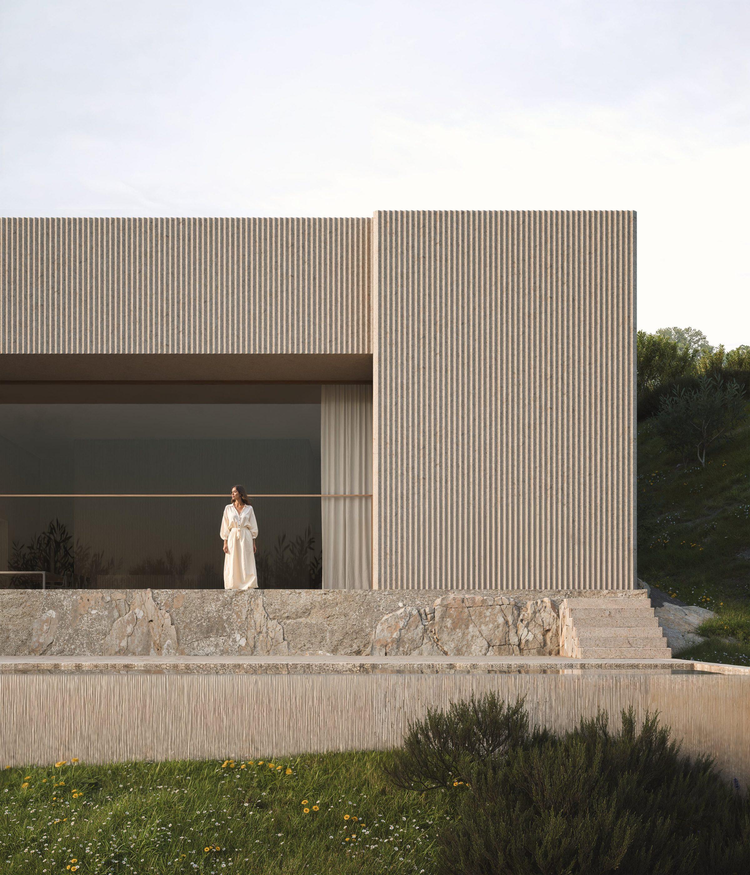 La Pedrera House — close facade with stone plinth and ribbed cladding