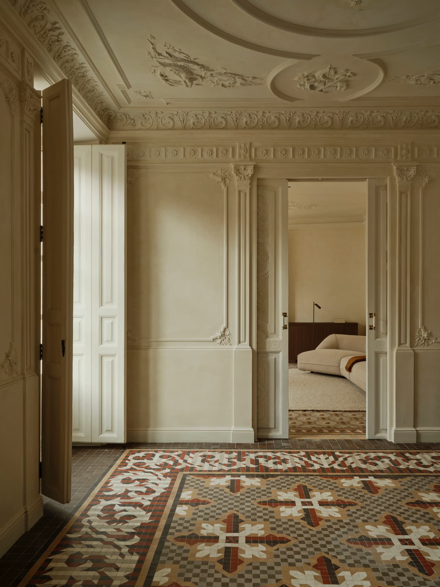 Ciutat Vella Apartment — open period doors revealing the oak-lined private room beyond