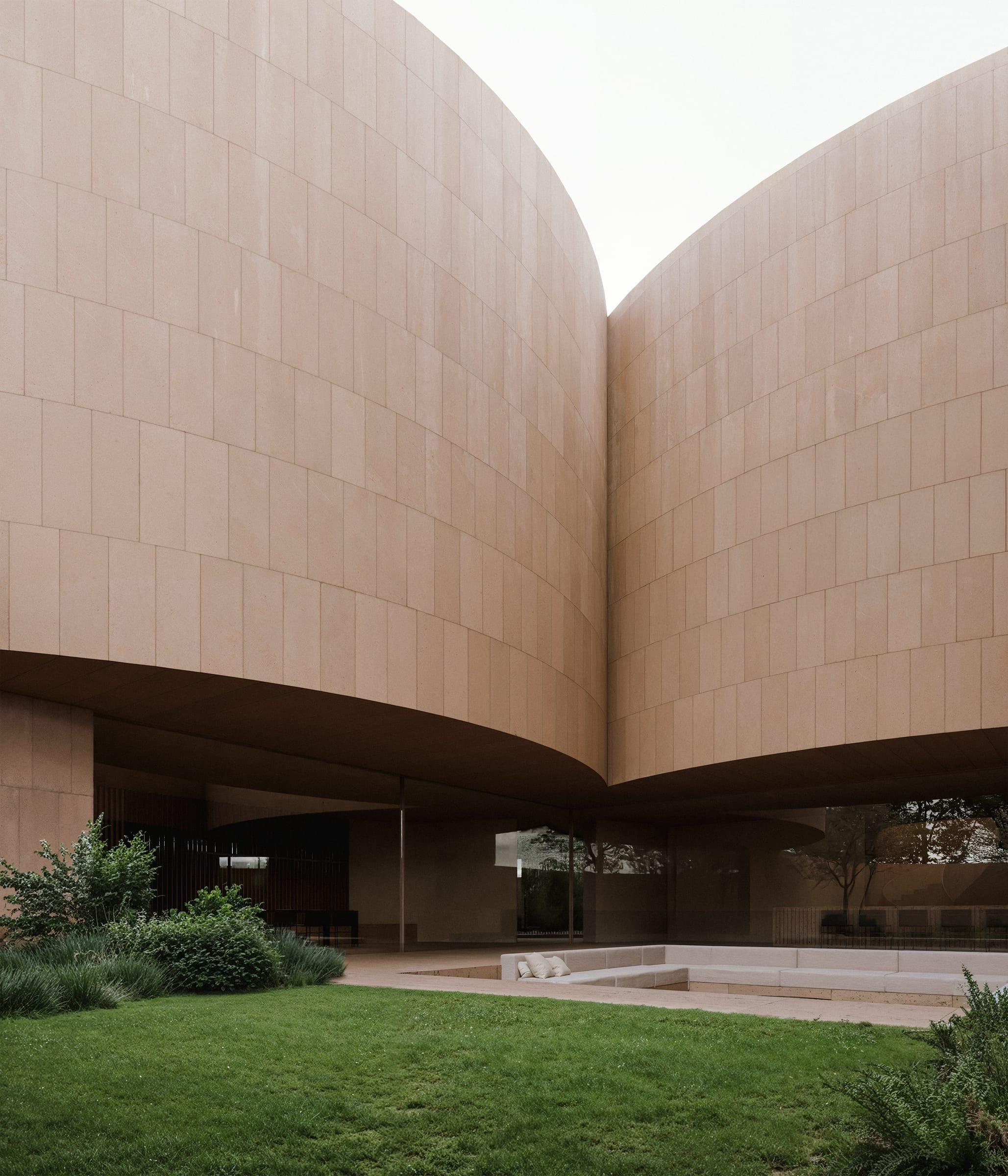 Round House — two drums meeting above the recessed transparent base