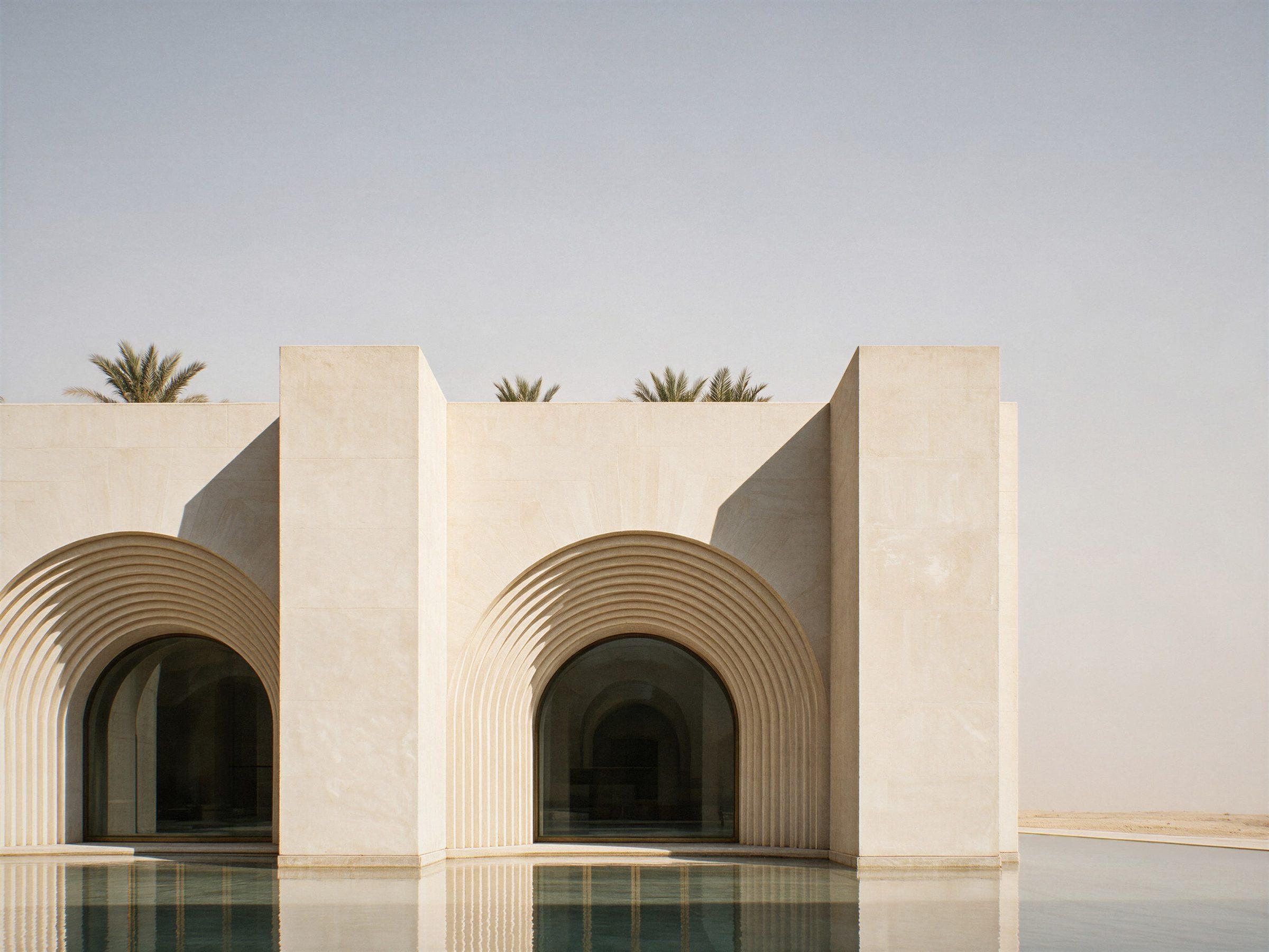 Museum of Contemporary Art, Saudi Arabia — the stone front over the reflecting pool, each arch framed by stepped rings