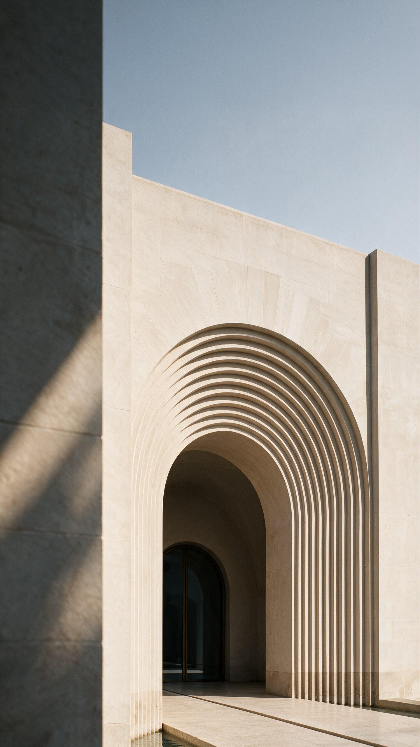 Museum of Contemporary Art, Saudi Arabia — a stepped arch in sunlight, the door held deep in the wall